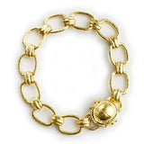 Small rectangular and banded link bracelet with gold dome box clasp