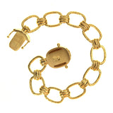 Small rectangular and banded link bracelet with gold "Dog" box clasp