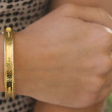 Thin Bangle Bracelet with Sets of Large and Small Gold Dots