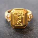 Octagonal Gold "Cherub with Flute" Ring with Diamonds Triads