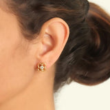 Round blue sapphire stud earring with wire arches