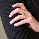 Cushion Cabochon Peridot Ring with Demantoid Garnet Triads